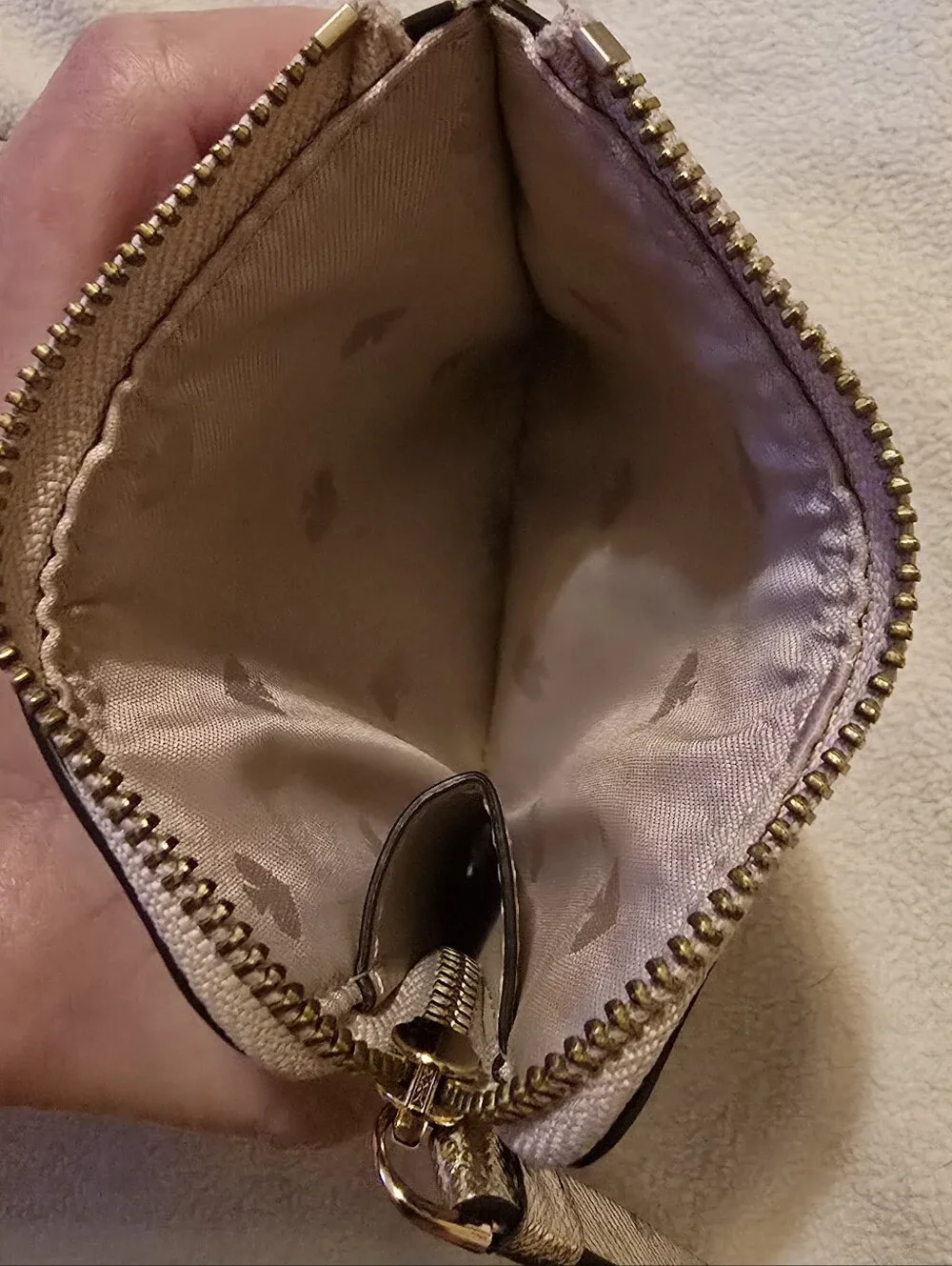 Kate Spade New York Staci small zip-around bifold wallet featuring a glittery ro